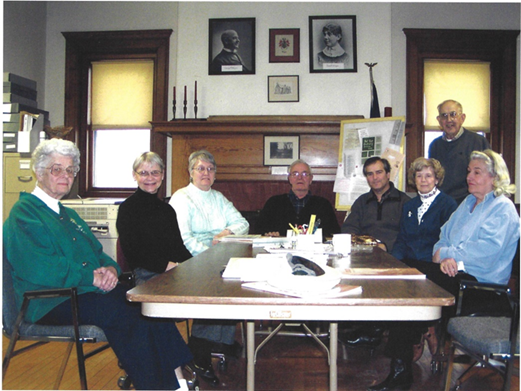 Group sitting at a table. 